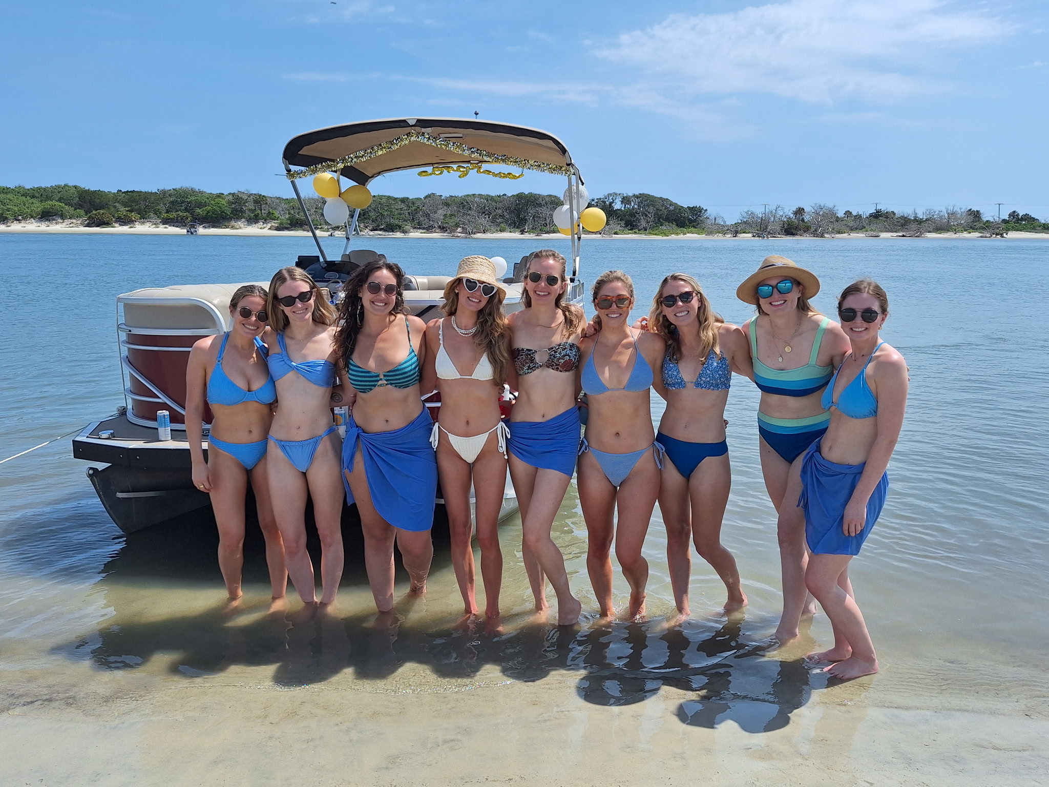 Group outing on the sandbar with pontoon